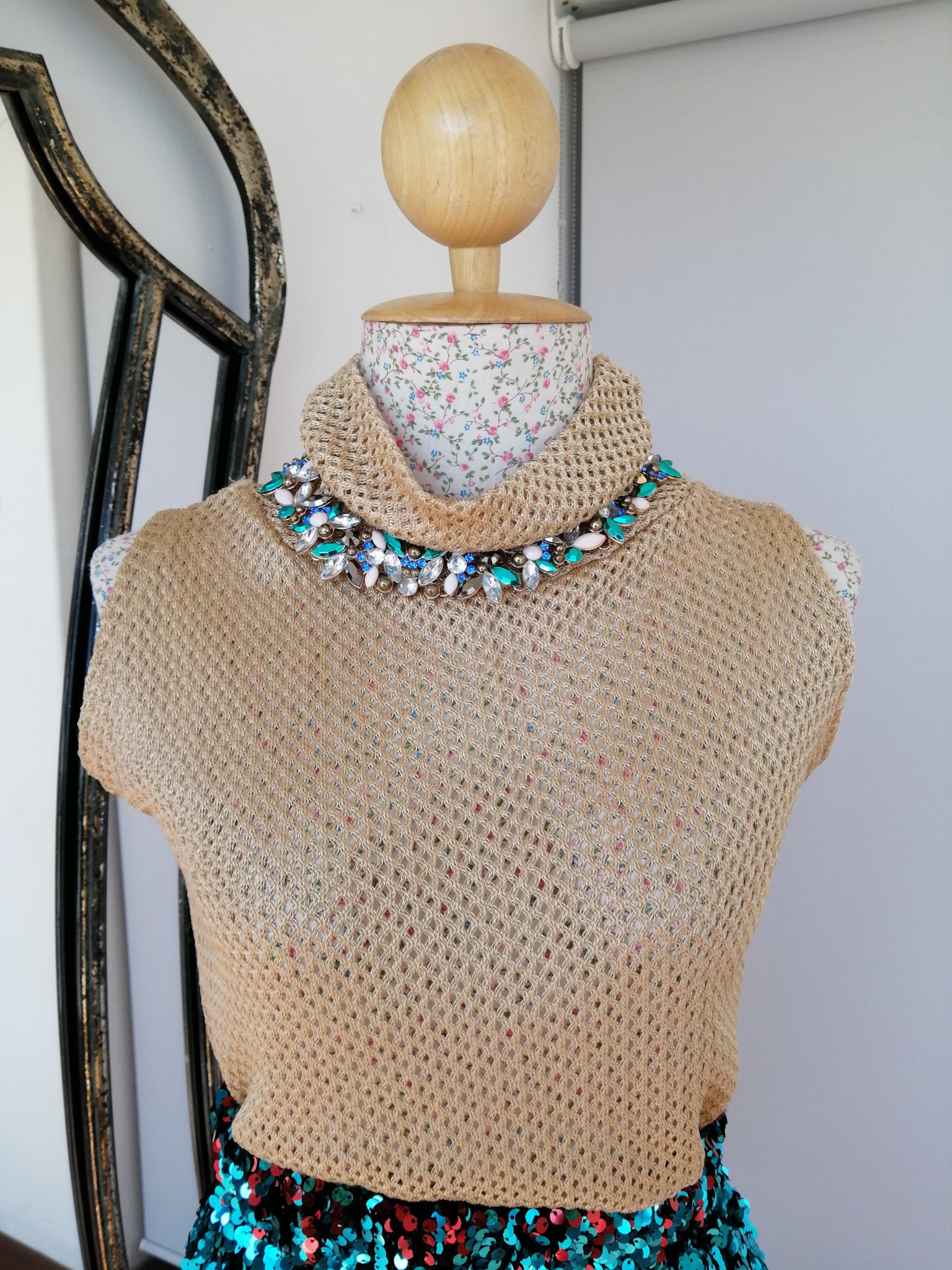 Gold funnel neck knitted sleeveless top