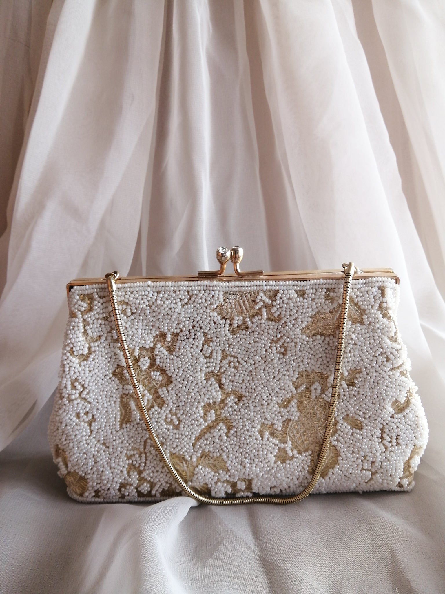 White & gold beaded clutch handbag