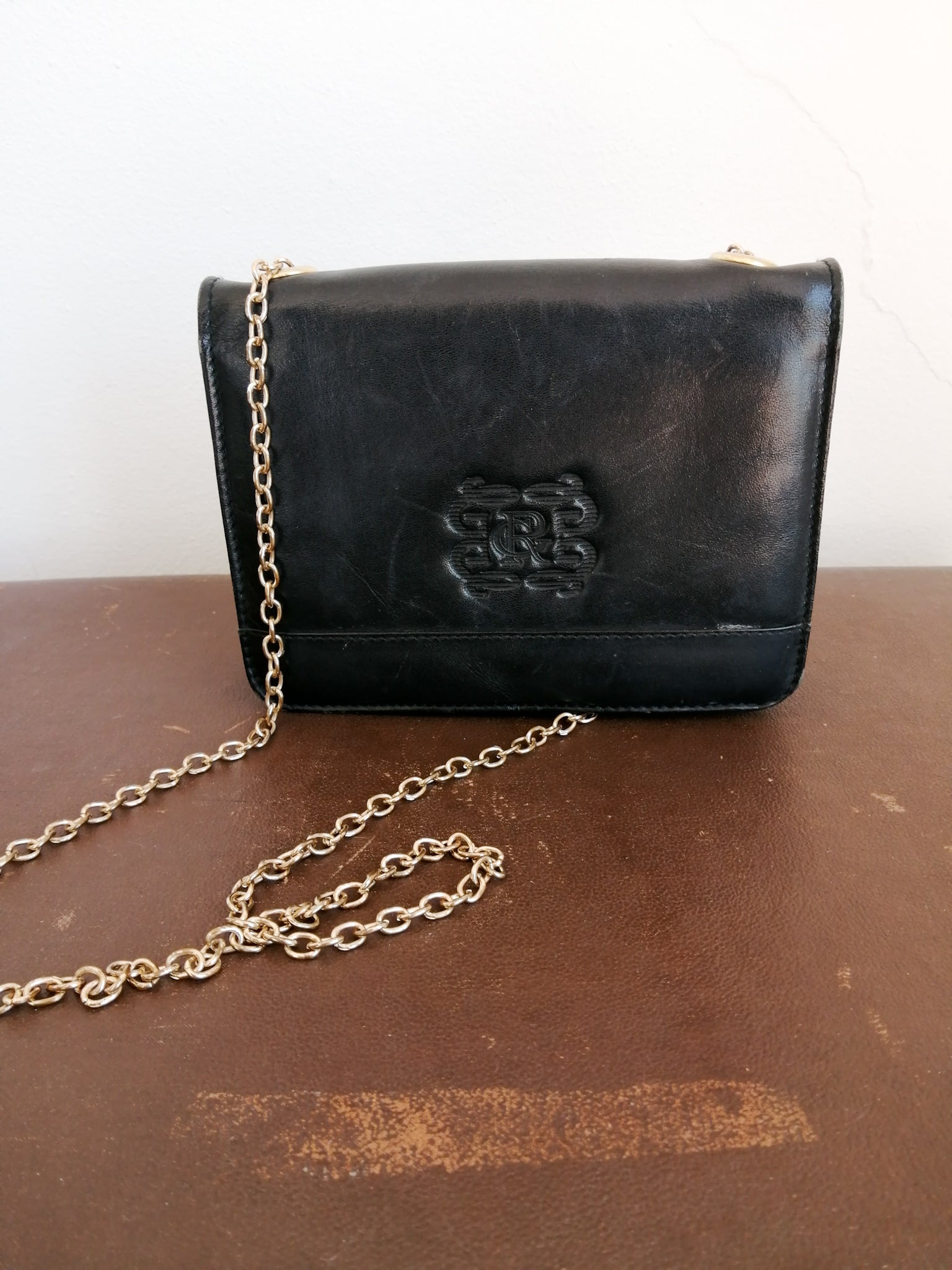 Black sling bag with gold chain